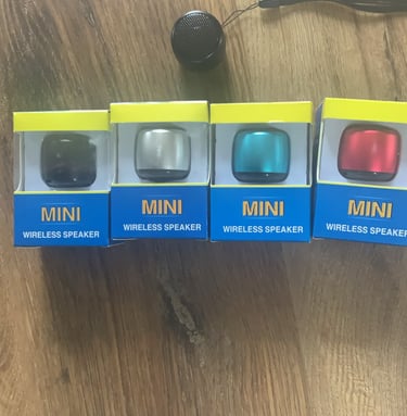 a group of three mini speakers with a microphone