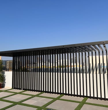 Custom-built rooftop sunshade structure and pergola for outdoor terrace lounge.