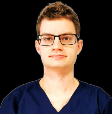 a man in a blue shirt and glasses