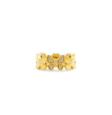 a gold ring with a butterfly on it