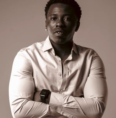 a man in a white shirt and a watch on his wrist