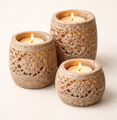 Hand-carved stone candle holders with floral cutwork design