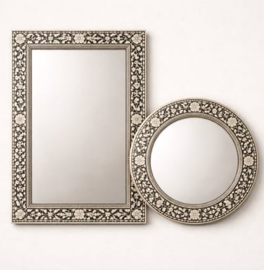 Decorative bone mirrors with carved borders and intricate inlay work.