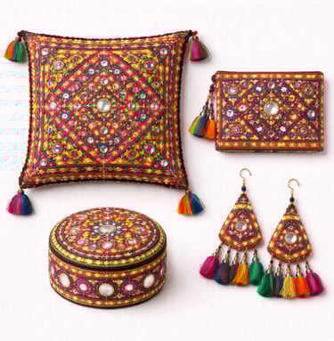 Mirror work embroidery items with reflective embellishments and tribal stitching.