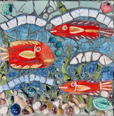 Whimsical underwater scene mosaic stepping stone with bright red fish by artist Julie Curson