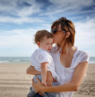 Expat family enjoying beach life in Spain protected by comprehensive life insurance