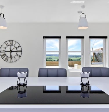 Modern kitchen design with integrated appliances  and a spacious island.