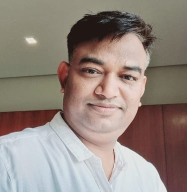 a man in a white shirt and tie dye on his shirt