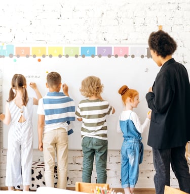 a teacher teaching children in a classroom