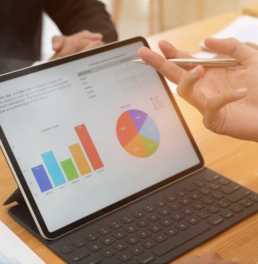 Analyzing business charts on a tablet to lead smart, prioritize, and optimize.
