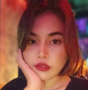 Lady with black top and one hand on face