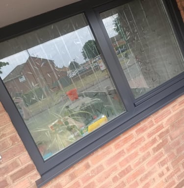 Finished dark grey UPVC windows after spraying on residential property in Worcester