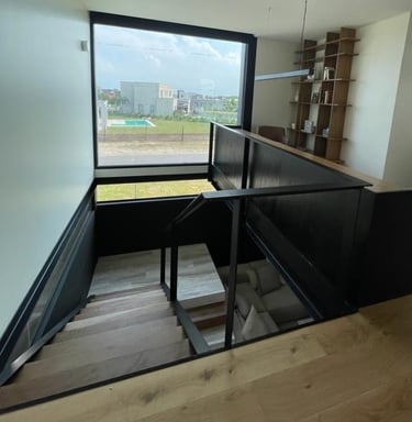 a staircase way with a view of a window