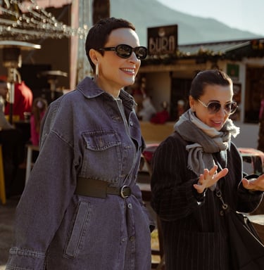 Two women talking on the street. Life style photographer Budva