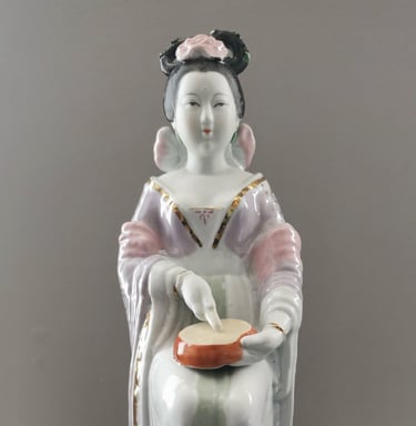 ceramic asian japanese chinese woman musician playing an instrument biqigu drum