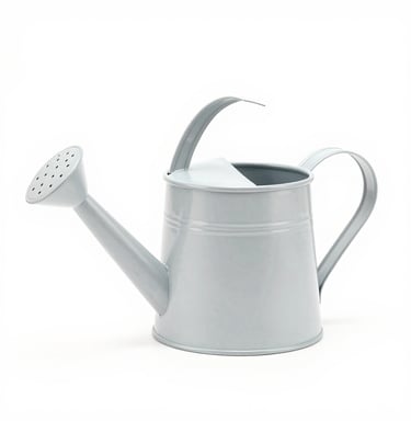 A sturdy garden hose coiled neatly beside a blooming flower bed on a sunny day.