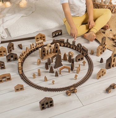 a child's play area with a train set up on the tracks
