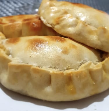 a plate of food with a pastry on it