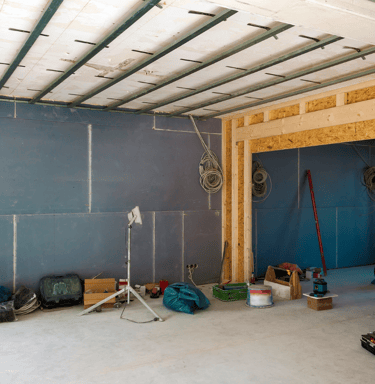 a room with a lot of construction materials and tools