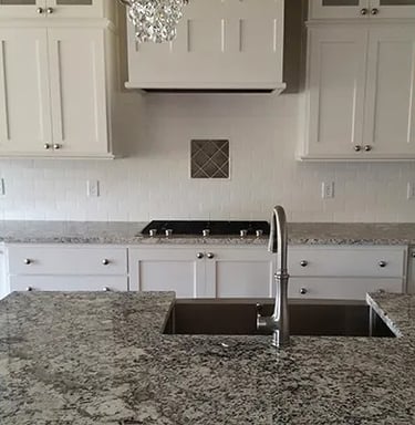 a kitchen with a sink and a chandelier