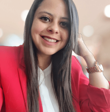 a woman in a red jacket and white shirt