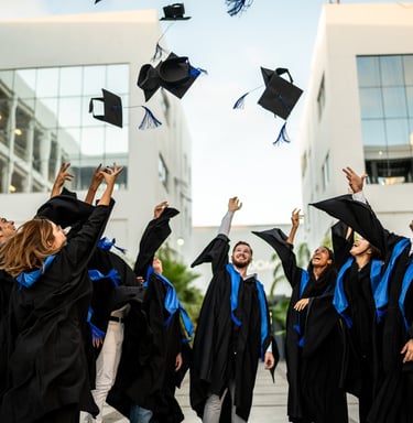 a group of graduates in black and blue caps and gowns