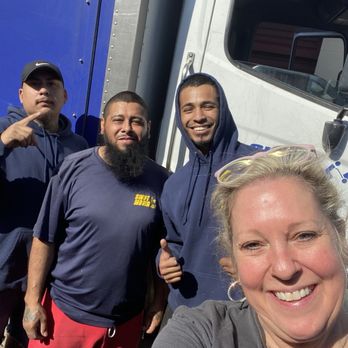 Swift Movers crew with a satisfied customer – showcasing our reliable team and commitment to deliver