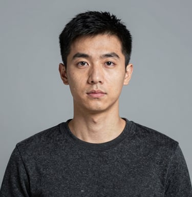 Black and pink themed portrait of a thoughtful author surrounded by books.