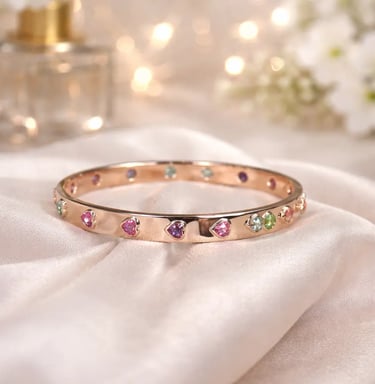 rainbow sapphire heart bangle in 18k rose gold