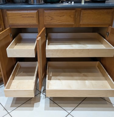 Sliding drawers for cabinets in a kitchen. 