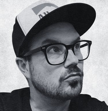 Here he is. Jordan Scott. Calgary Writer, Director, Producer. Circa 2026. He's looking up here. 