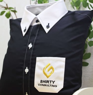 a black shirt with white collar and pocket as pillow