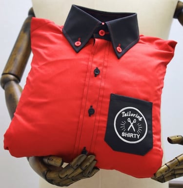 a red shirt with black collar and pocket as pillow