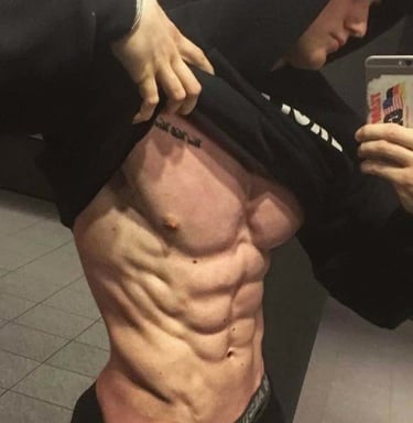 a man revealing his muscular abdomen