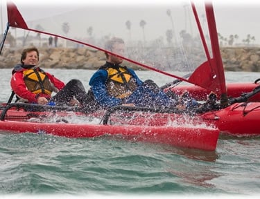 a couple of people in a kayak in the water