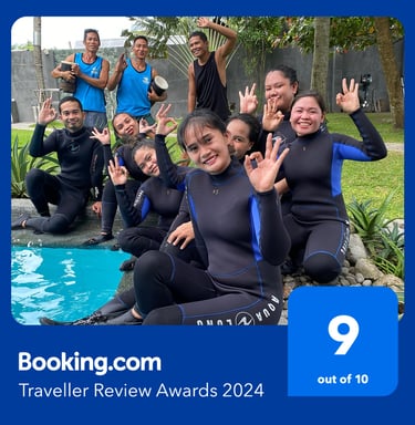 a group of people standing around a pool