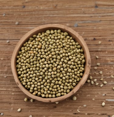 Close-up of vibrant cardamom pods spilling from a rustic burlap sack onto a wooden table.