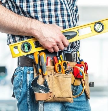 a man in a tool belt belt holding a tool belt