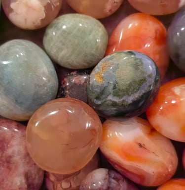 a bunch of different colored gemestones on a table