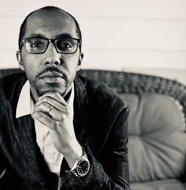 Portrait of J Allen Phelps, author of "The Girl No Boy Could love," exuding creativity and warmth.