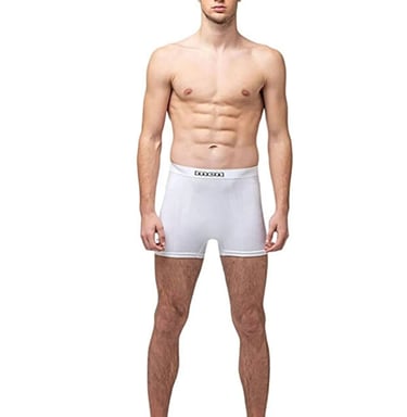 Athletic man wearing white cotton boxer briefs for men with a comfortable elastic waistband.