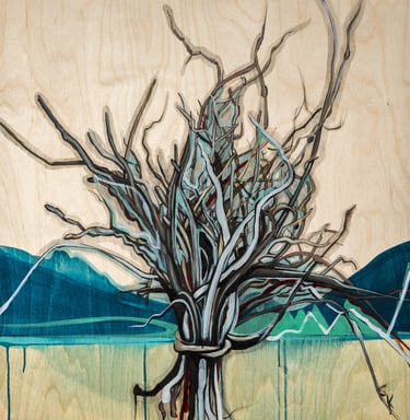 a bundle of twigs against a mountain background
