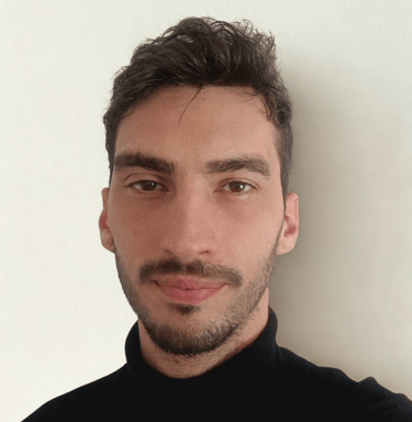 a man with a beard and a black shirt