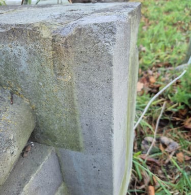 Basalt heritage stone buiding detail partially cleaned with laser cleaner