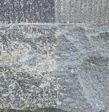 Basalt stone buiding detail partially restored with laser cleaner in Christchurch New Zealand