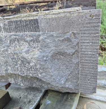 Basalt stone buiding detail partially restored with laser cleaner in Christchurch New Zealand