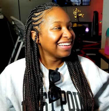 A woman with box braids hairstyle