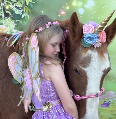 A fairy princess cuddles Snickers, the magical unicorn