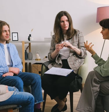 a group of people sitting around a table
