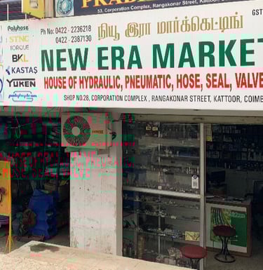 Shop outside photo of New Era Marketing. Main road facing shop in Rangakonar street, Kattoor
